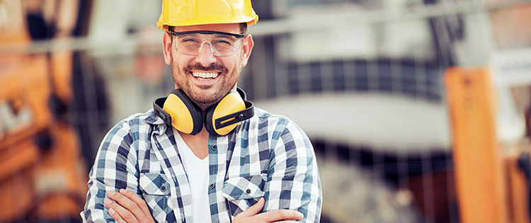 A man smiling in a hard hat
